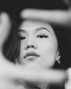 woman black and white zoom on her face skin beauty and glowy