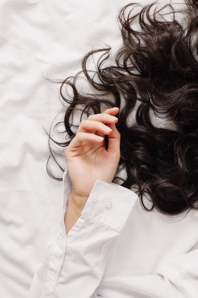 woman with a hand in her hair