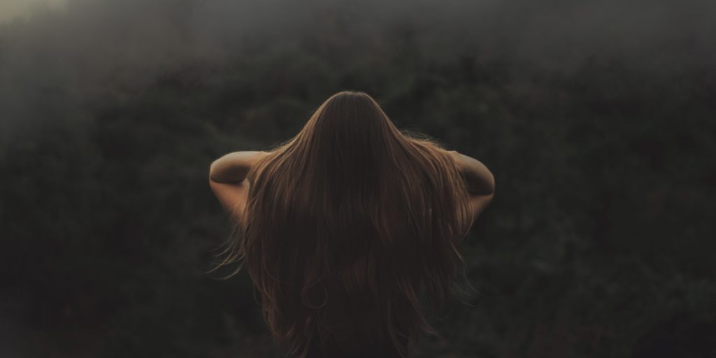 hair women back beautiful hair with her hand in her hair