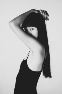 women with long hair asian girl with her hand in her hair